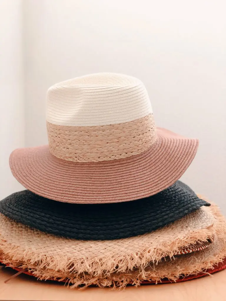 A stack of three hats on top of each other.